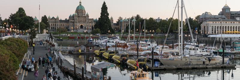 Inner Harbour marina at dusk, with the Parliament Buildings behind