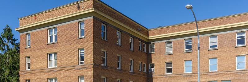 Brick wing of Royal Jubilee Hospital in Victoria under a blue sky